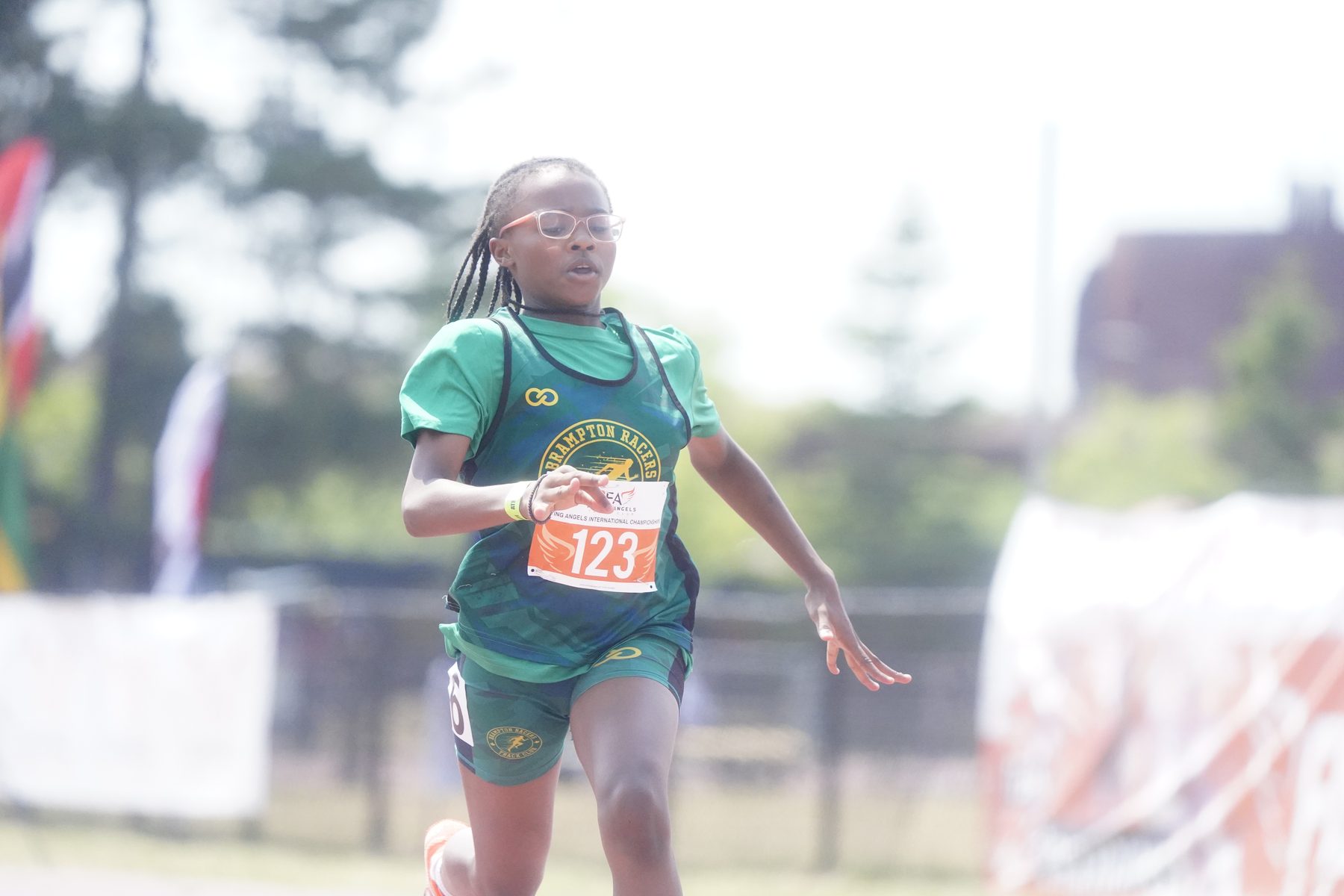 Young sprinter mid-race, eyes on the line