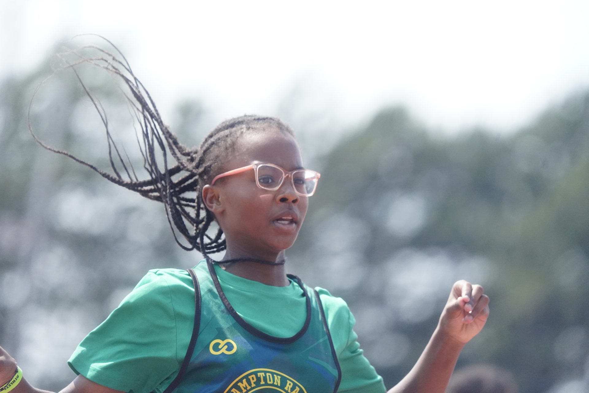 Sprinter at full speed, hair flying