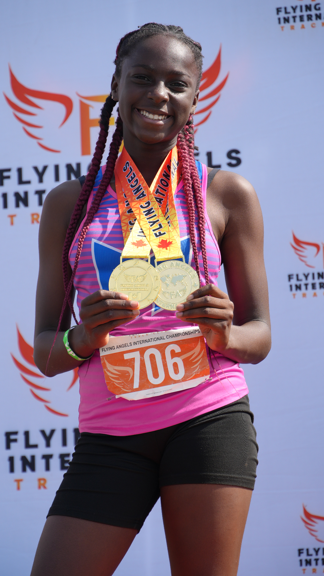 Young athlete on the podium with two gold medals