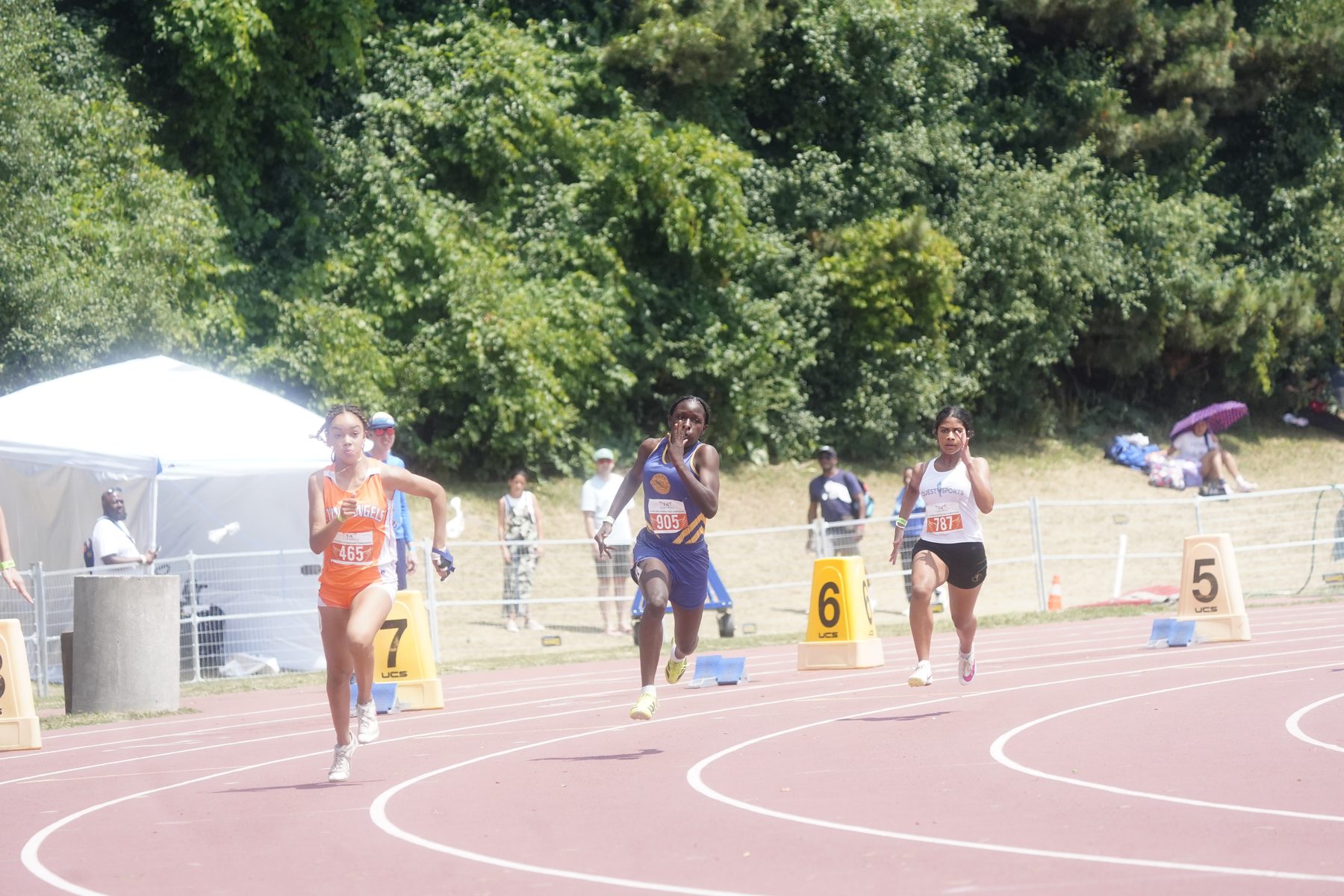 Sprinters exploding out of the blocks together