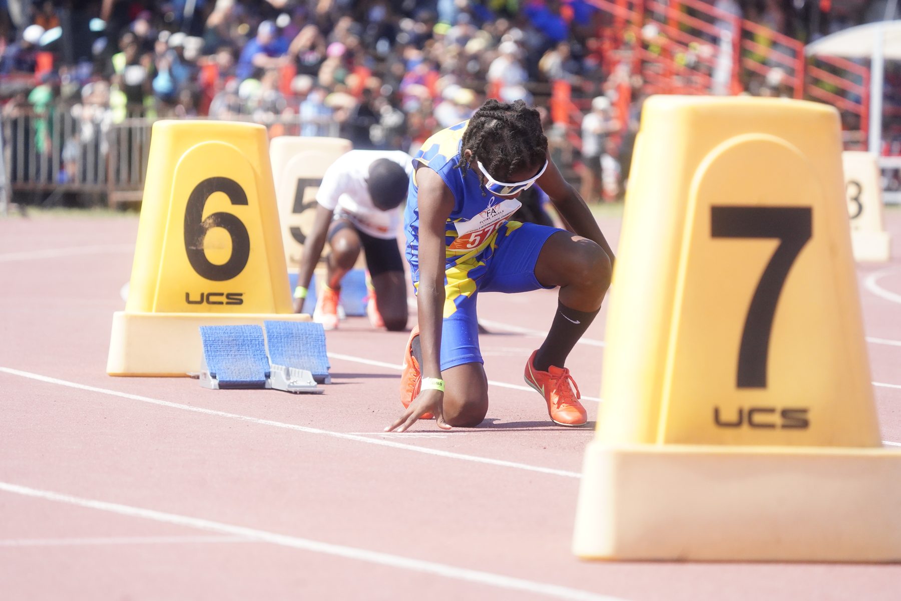 Athlete in the set position at the blocks